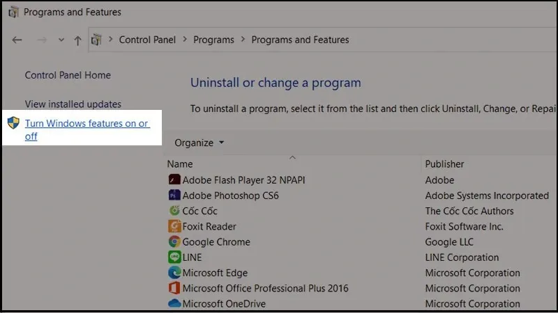 Bước 3: Khi cửa sổ Programs hiện lên, tìm và chọn mục Turn Windows features on or off